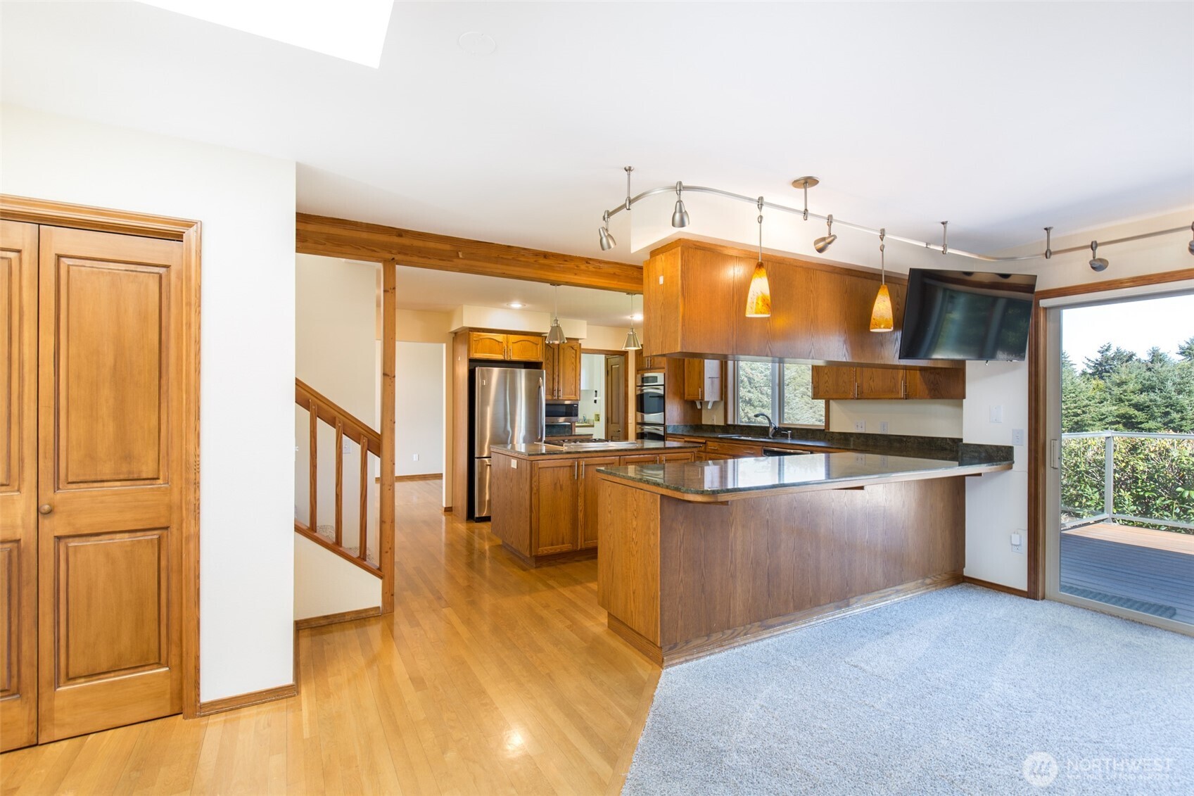 81 Bon Jon View Way Sequim, WA 98382 - Photo 18 of 38 a view of living room kitchen with stainless steel appliances wooden floor and large window