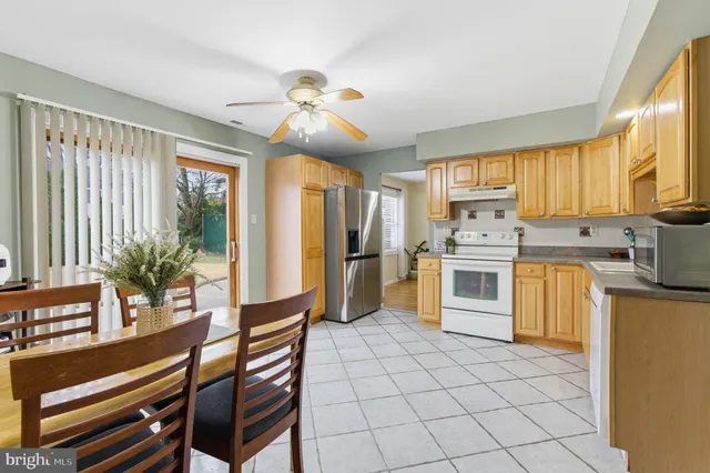 a kitchen with appliances cabinets and a sink