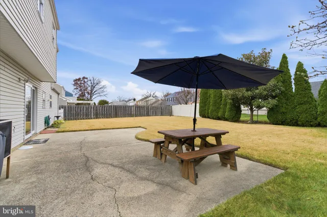 a view of a backyard with sitting area