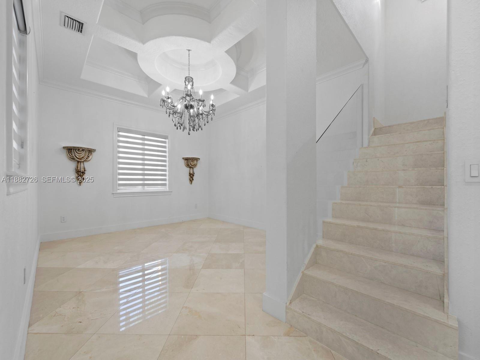 12770 Southwest 188th Street Miami, FL 33177 - Photo 13 of 65 a view of entryway with chandelier