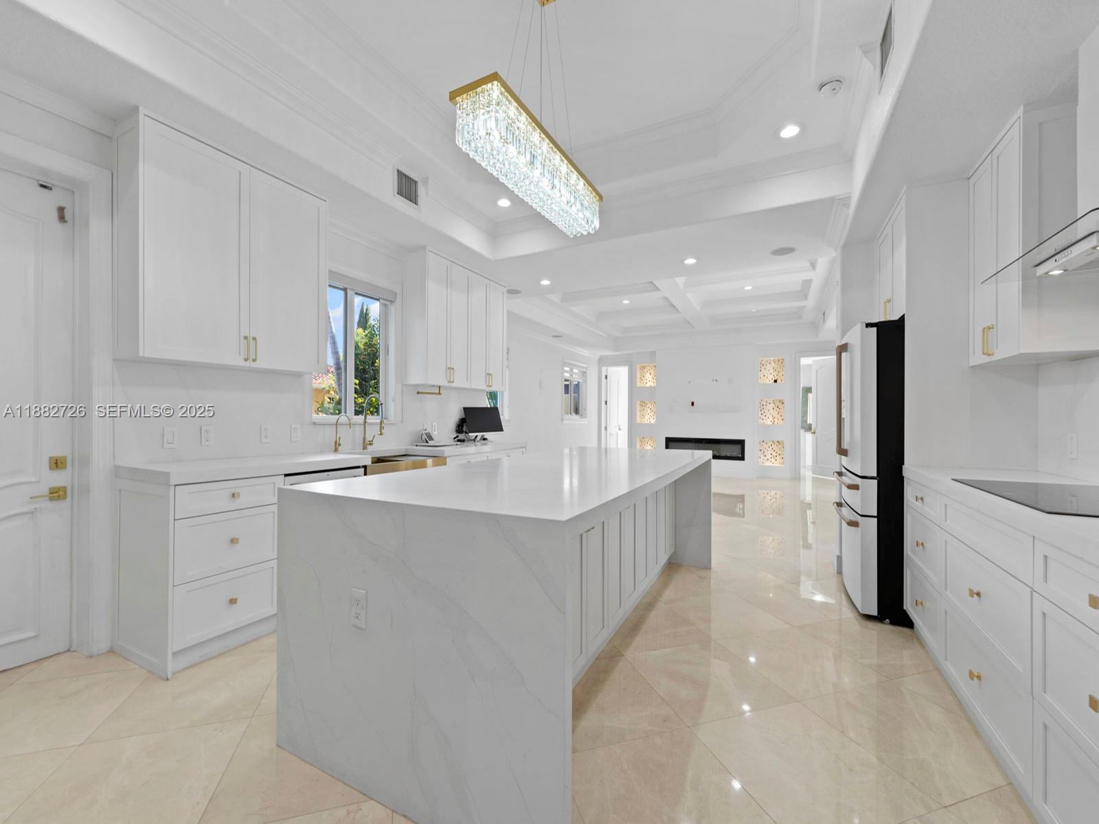 12770 Southwest 188th Street Miami, FL 33177 - Photo 15 of 65 a kitchen with white cabinets and refrigerator