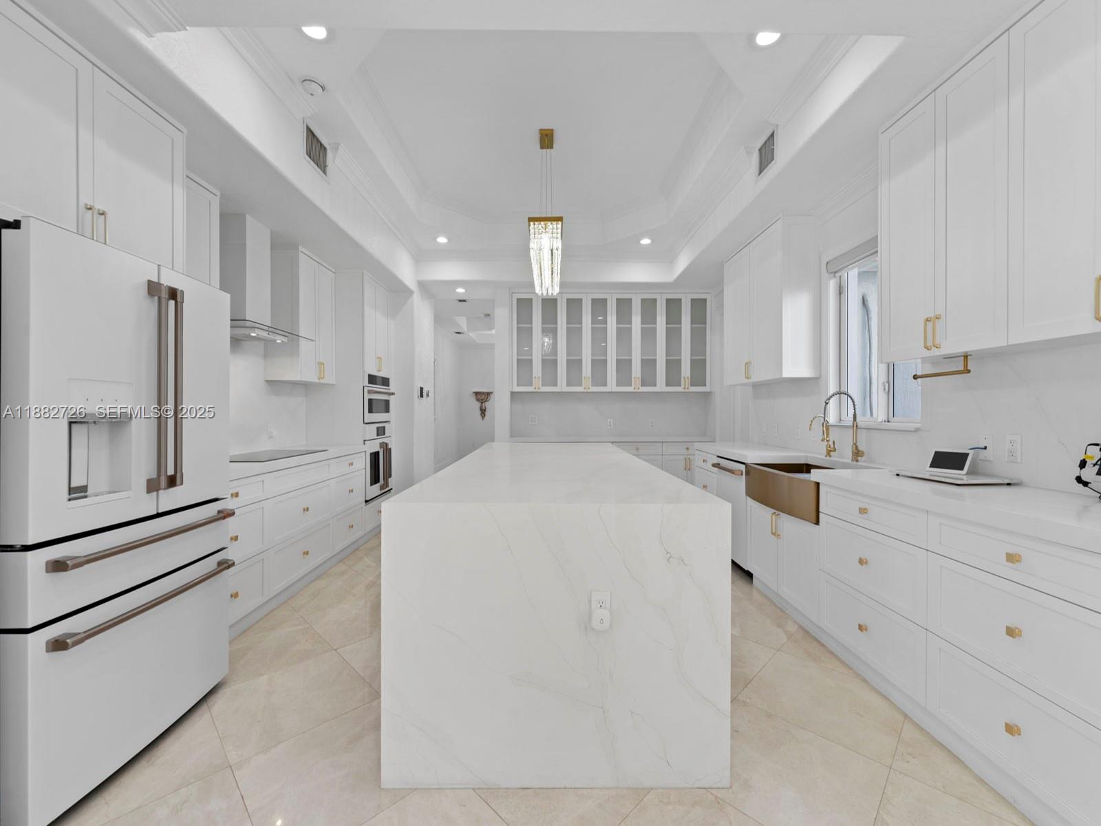12770 Southwest 188th Street Miami, FL 33177 - Photo 18 of 65 a large white kitchen with cabinets