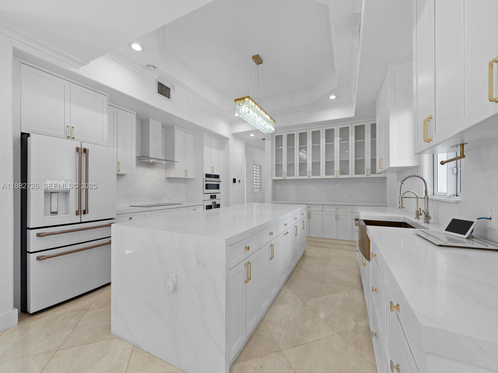 12770 Southwest 188th Street Miami, FL 33177 - Photo 19 of 65 a large white kitchen with stainless steel appliances lots of counter top space