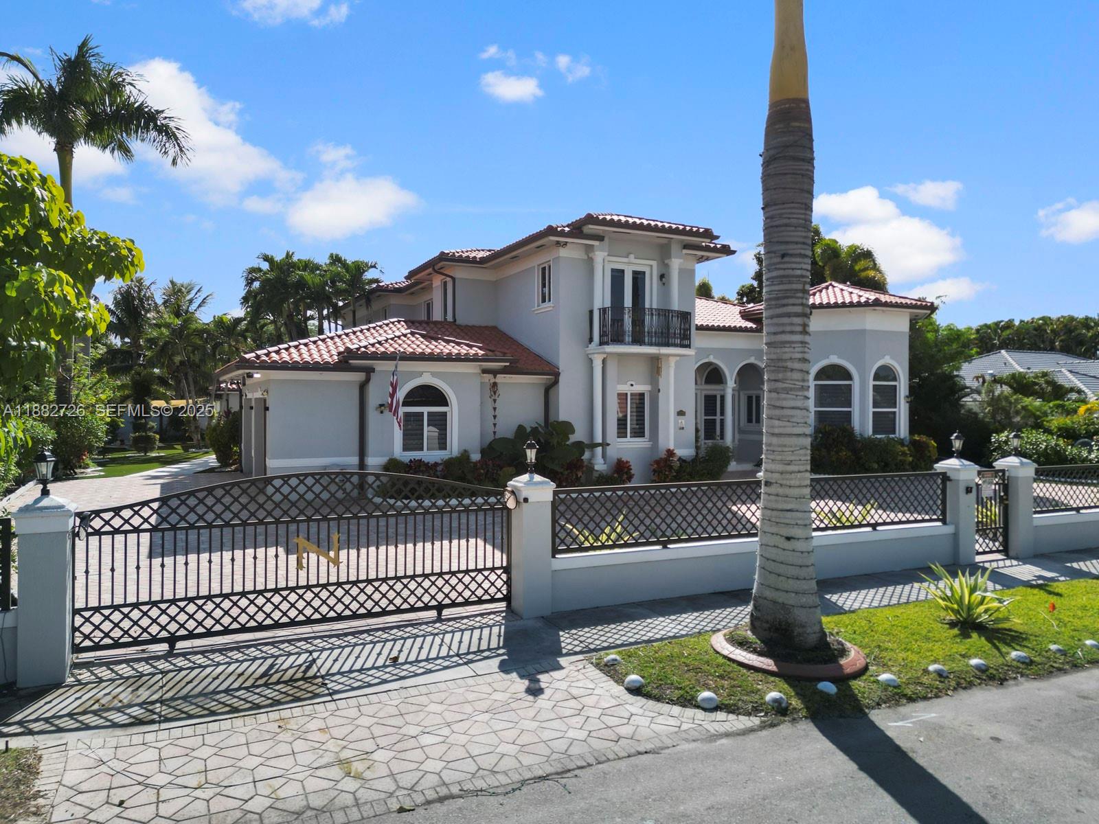 12770 Southwest 188th Street Miami, FL 33177 - Photo 2 of 65 a front view of a house with a garden