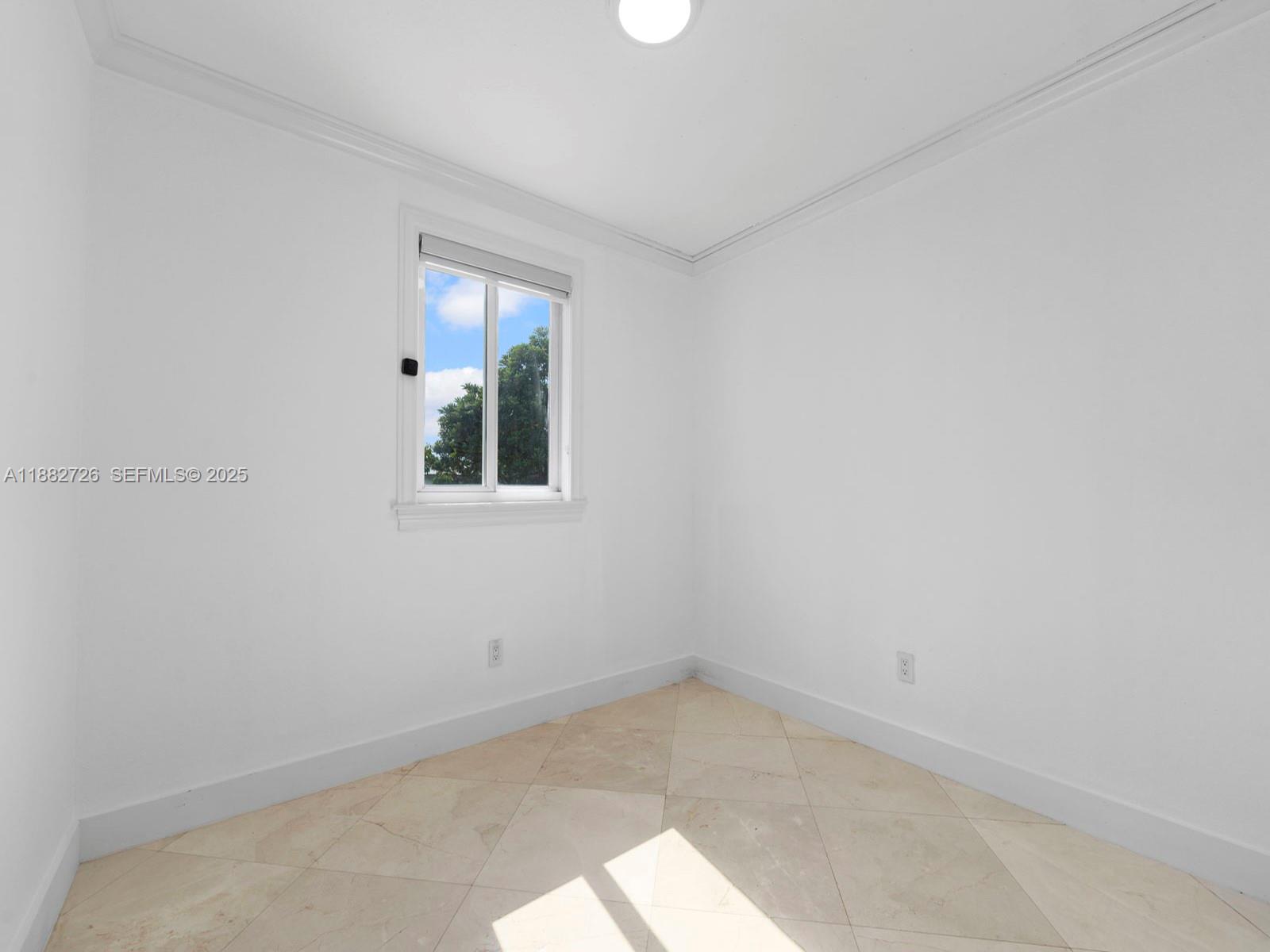 12770 Southwest 188th Street Miami, FL 33177 - Photo 24 of 65 an empty room with a window