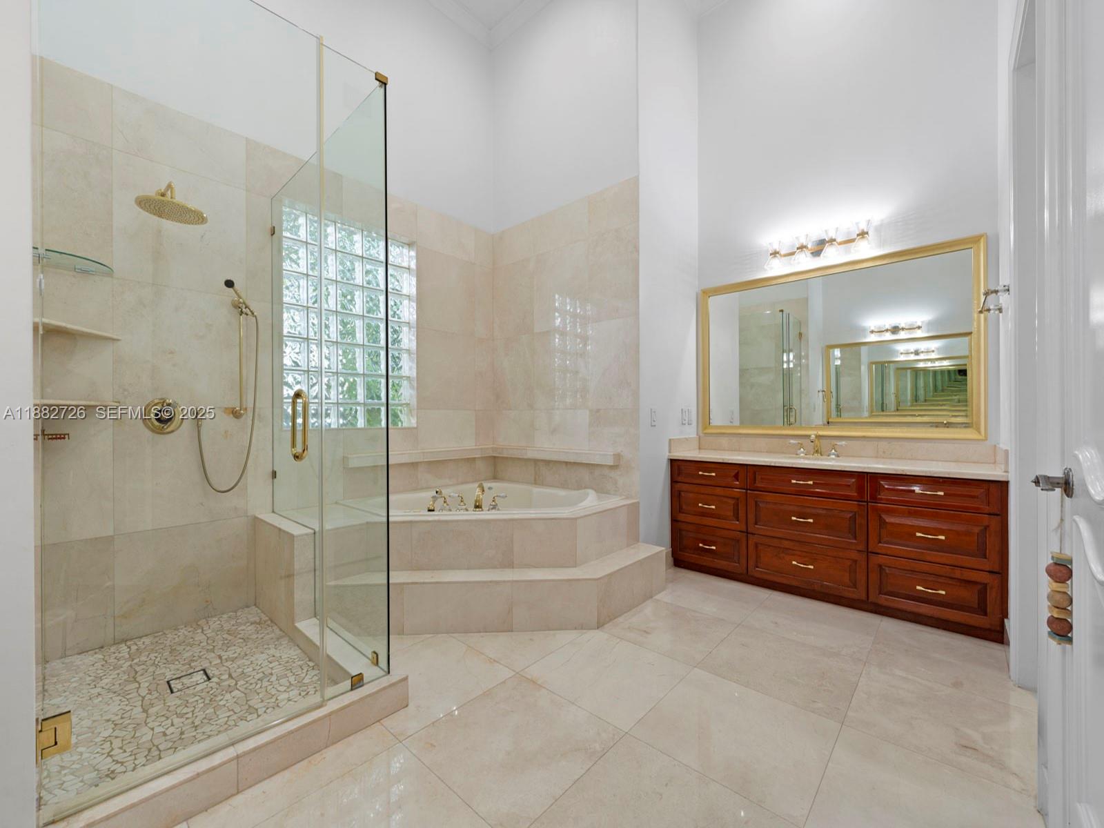 12770 Southwest 188th Street Miami, FL 33177 - Photo 26 of 65 a bathroom with a tub shower vanity and a sink