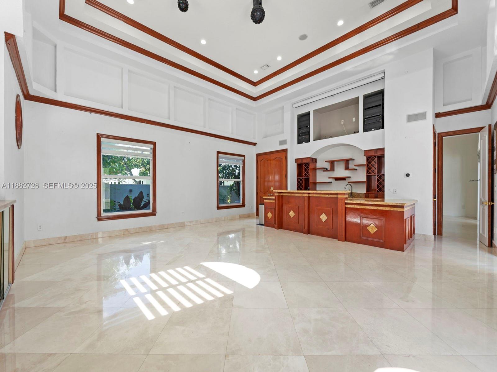 12770 Southwest 188th Street Miami, FL 33177 - Photo 28 of 65 a living room with furniture and a flat screen tv