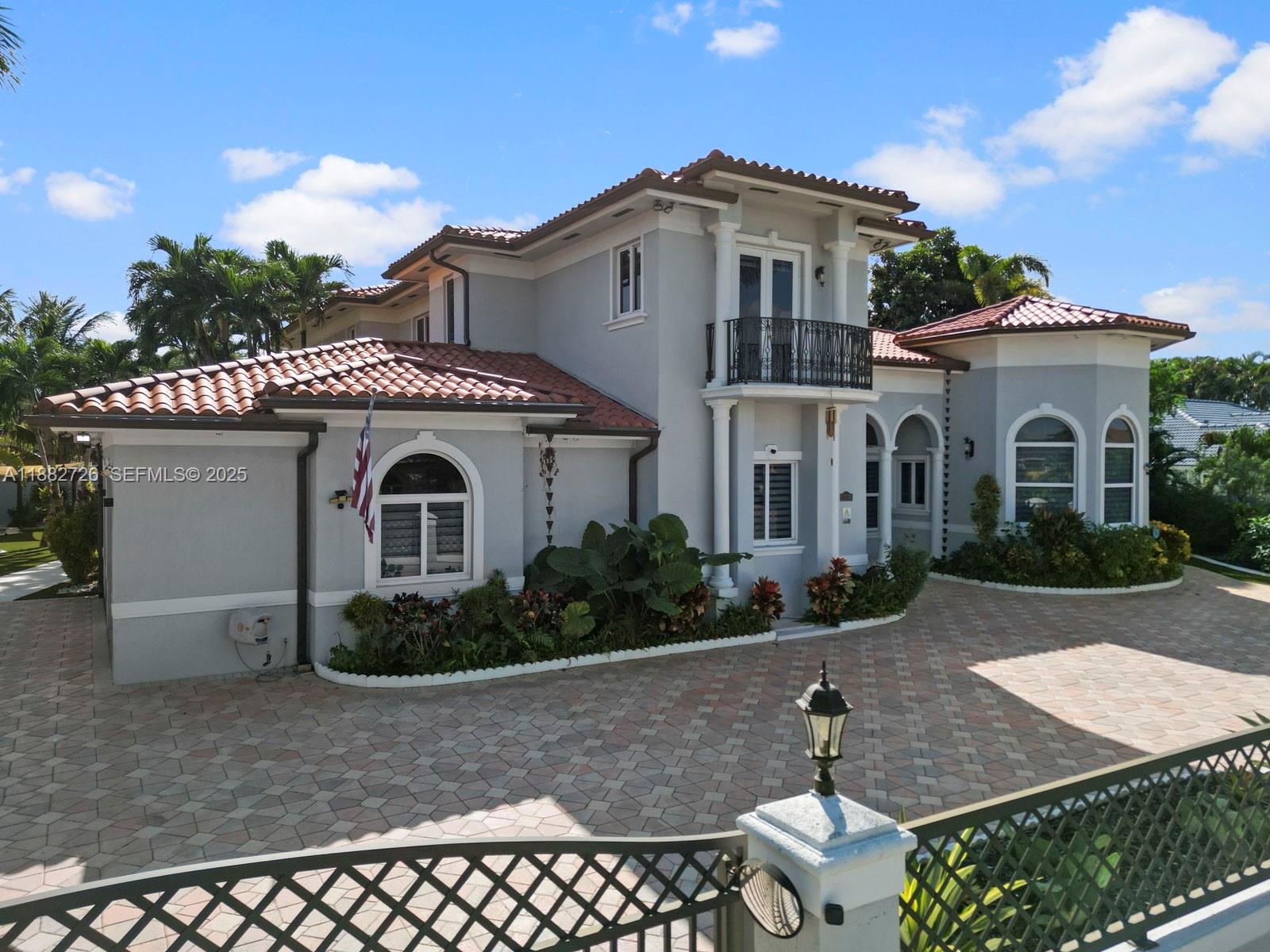 12770 Southwest 188th Street Miami, FL 33177 - Photo 3 of 65 a front view of a house with garden