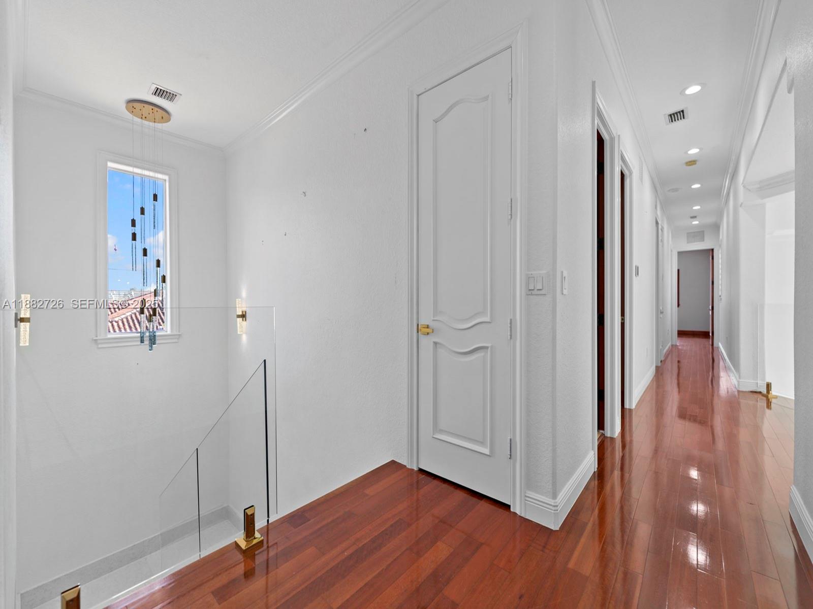 12770 Southwest 188th Street Miami, FL 33177 - Photo 32 of 65 a view of a hallway with wooden floor