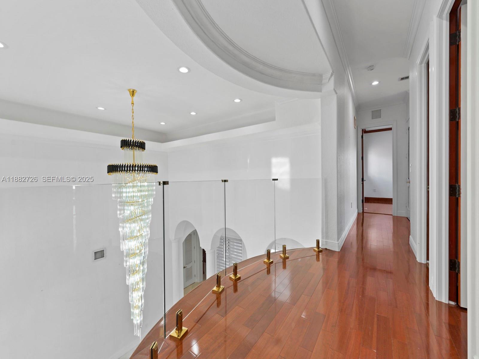 12770 Southwest 188th Street Miami, FL 33177 - Photo 37 of 65 a view of a dining room and livingroom with furniture wooden floor a chandelier