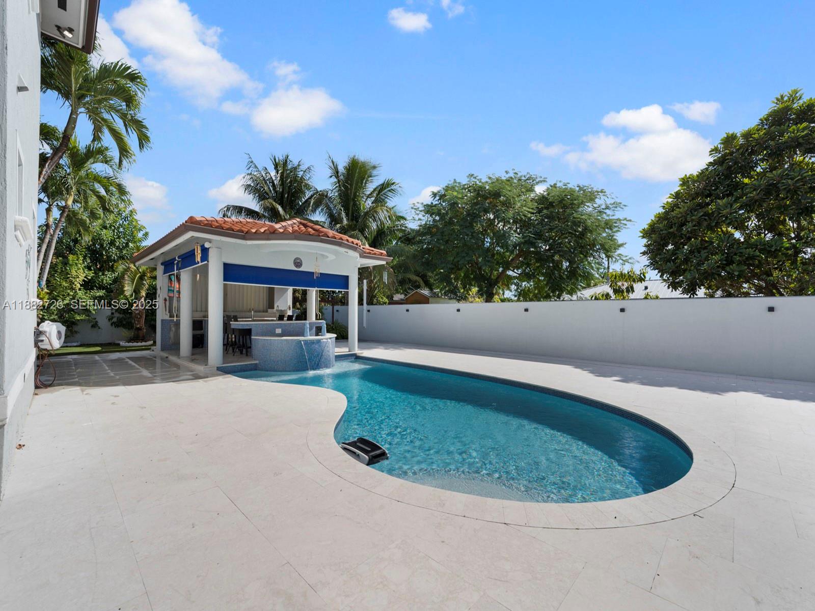 12770 Southwest 188th Street Miami, FL 33177 - Photo 47 of 65 a view of a house with a swimming pool and porch
