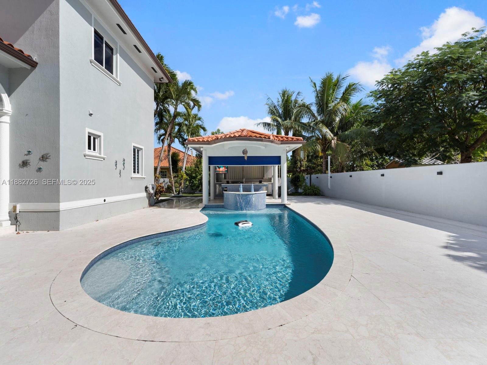 12770 Southwest 188th Street Miami, FL 33177 - Photo 48 of 65 a view of a house with swimming pool and a yard