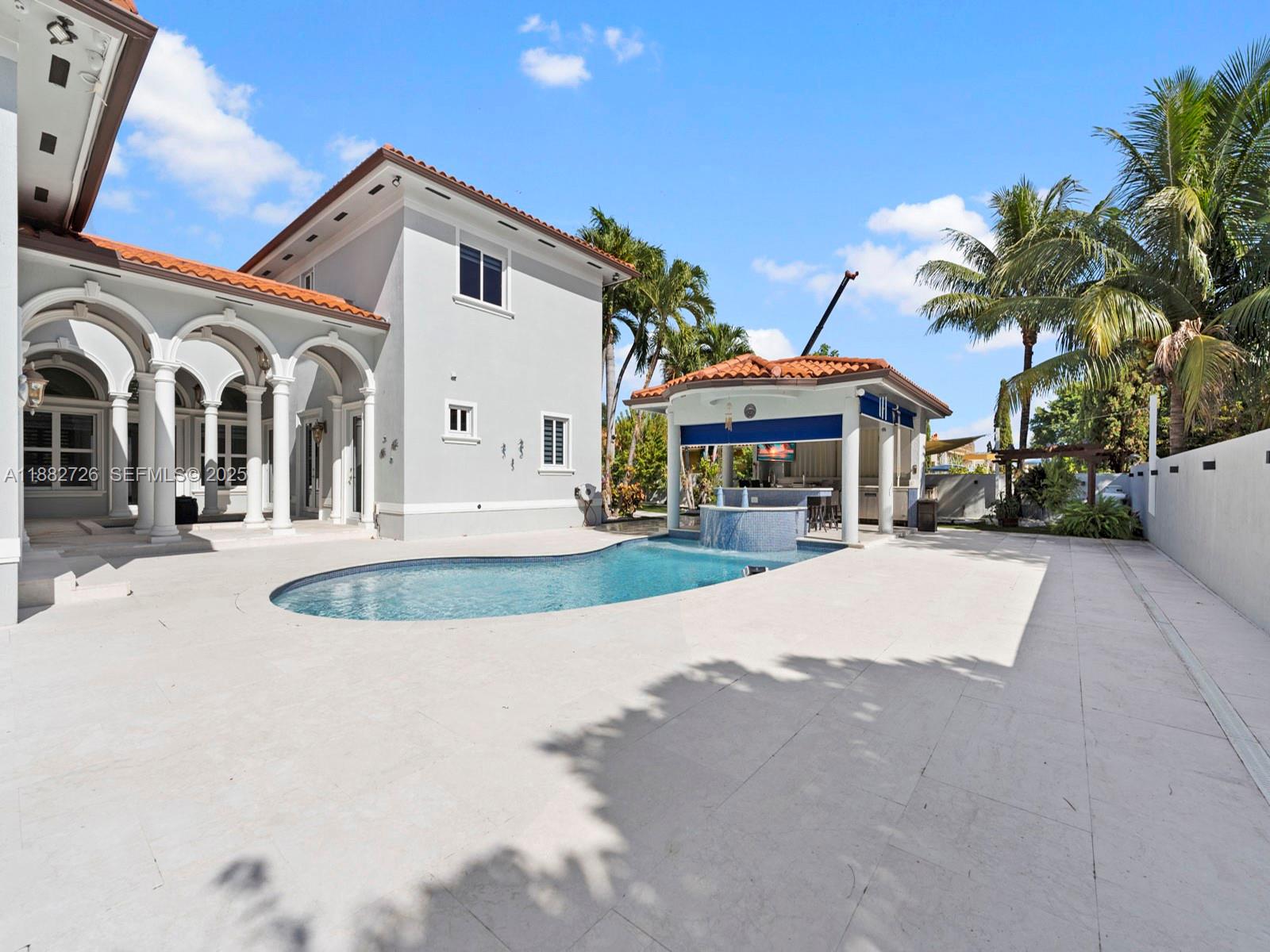 12770 Southwest 188th Street Miami, FL 33177 - Photo 49 of 65 a front view of a house with a yard and garage