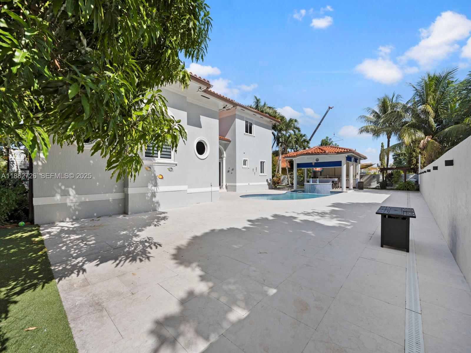 12770 Southwest 188th Street Miami, FL 33177 - Photo 51 of 65 a front view of a house with a yard