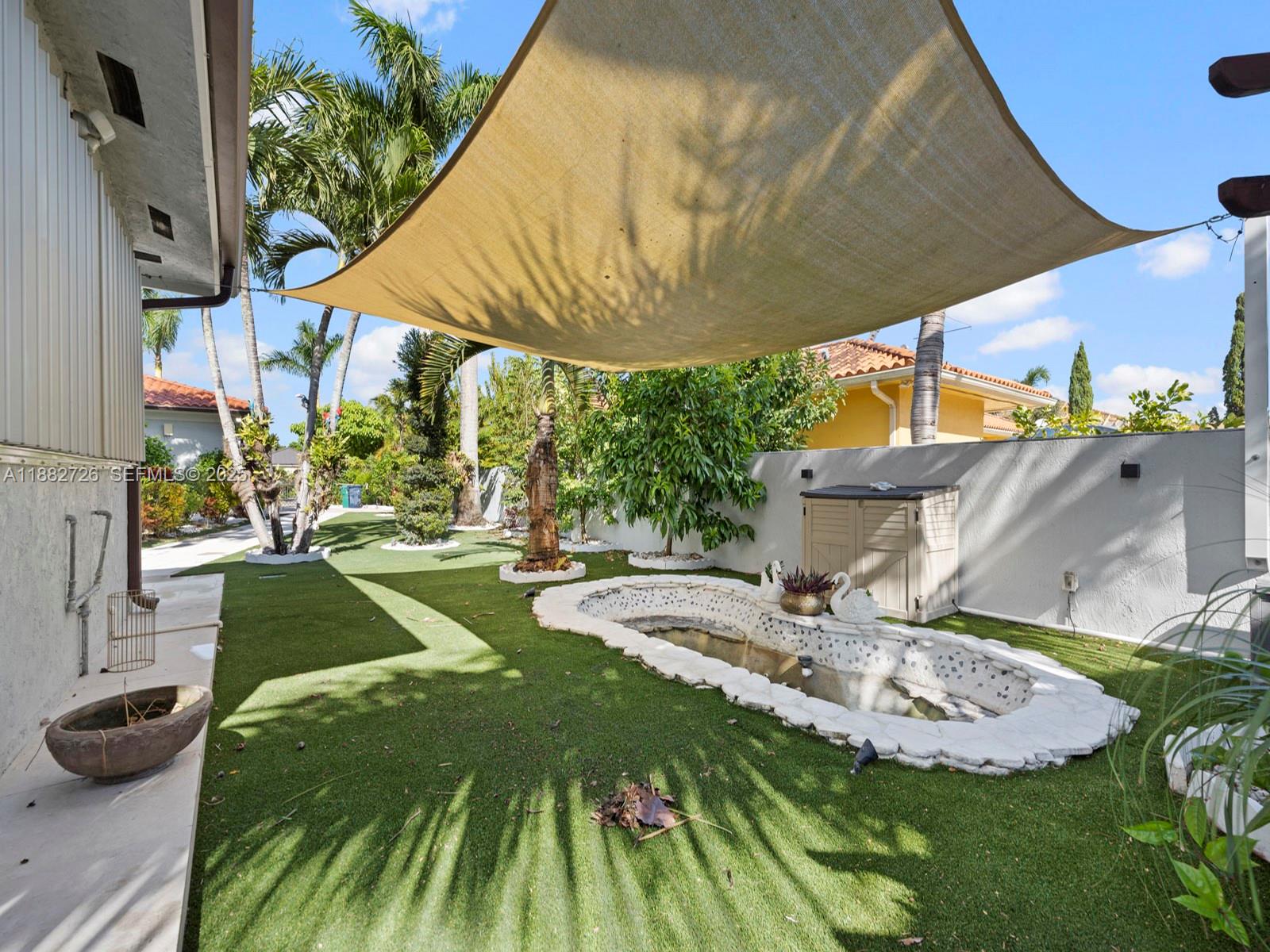 12770 Southwest 188th Street Miami, FL 33177 - Photo 58 of 65 a view of a backyard with plants and a patio