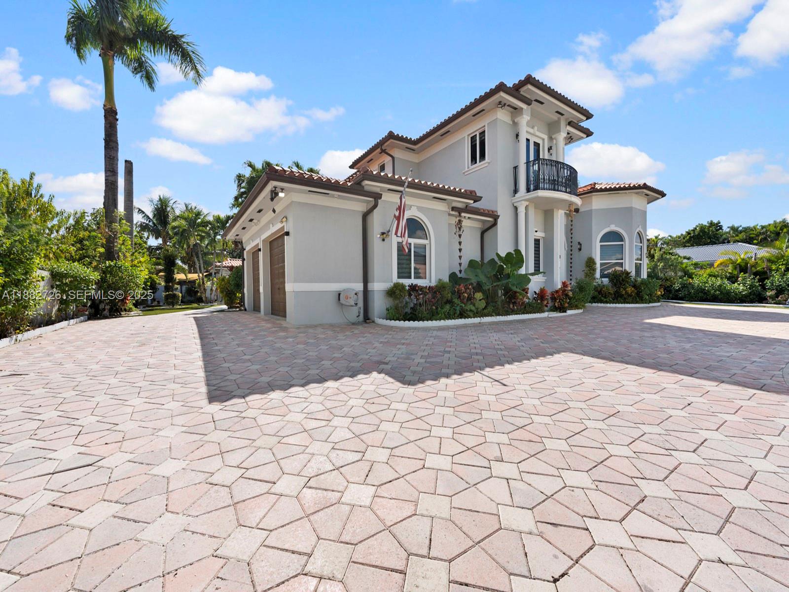 12770 Southwest 188th Street Miami, FL 33177 - Photo 63 of 65 a front view of a house with a yard and garage