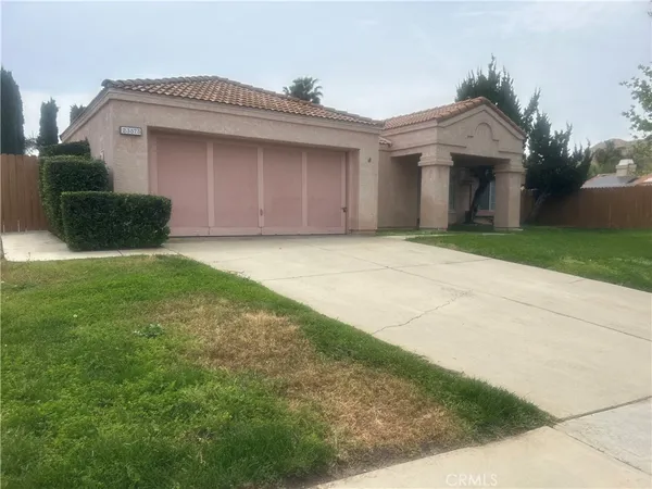 a front view of a house with yard