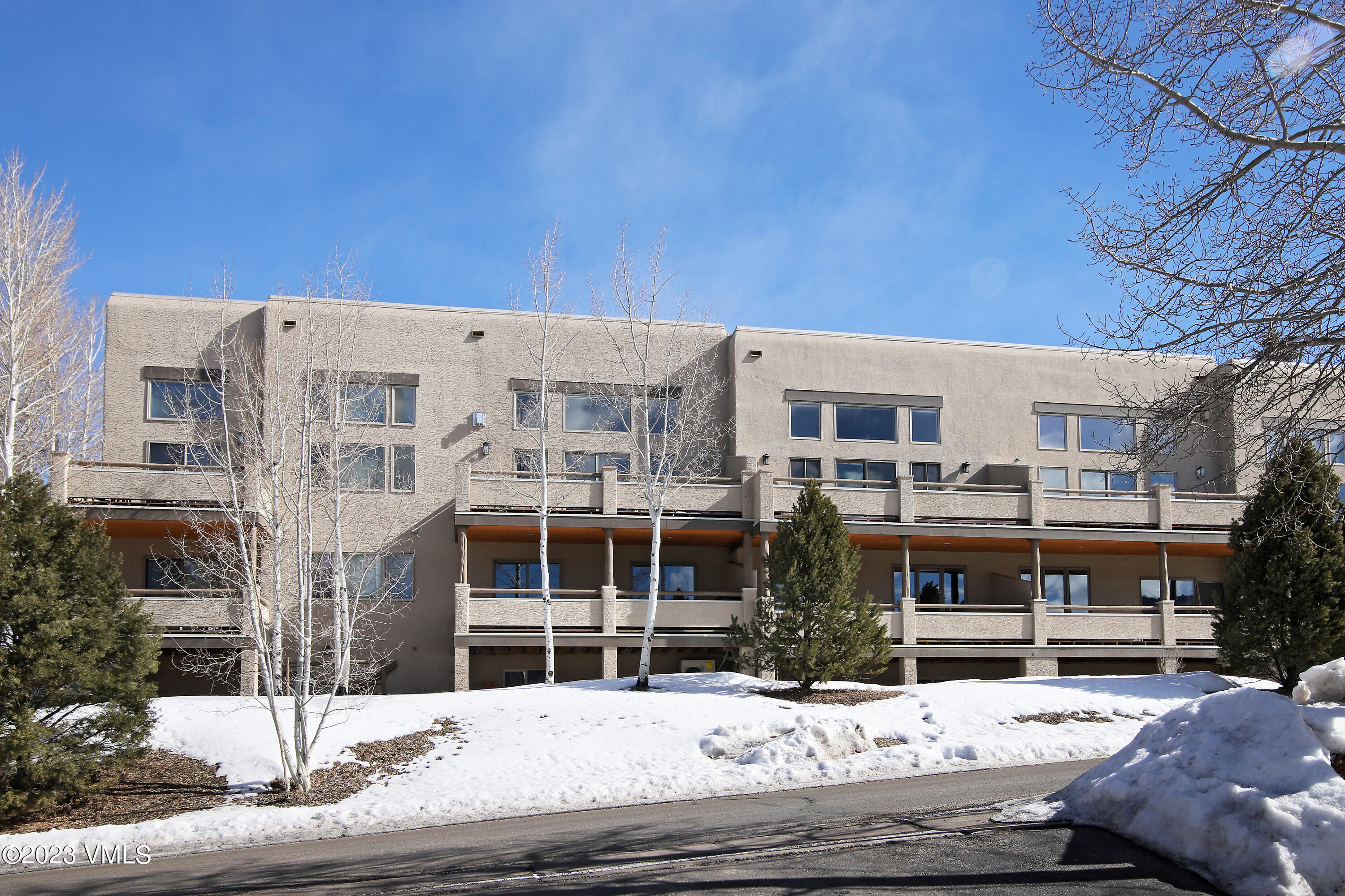751 Singletree Road, Unit 6 Edwards, CO 81632 - Photo 12 of 30 a building view covered with large trees