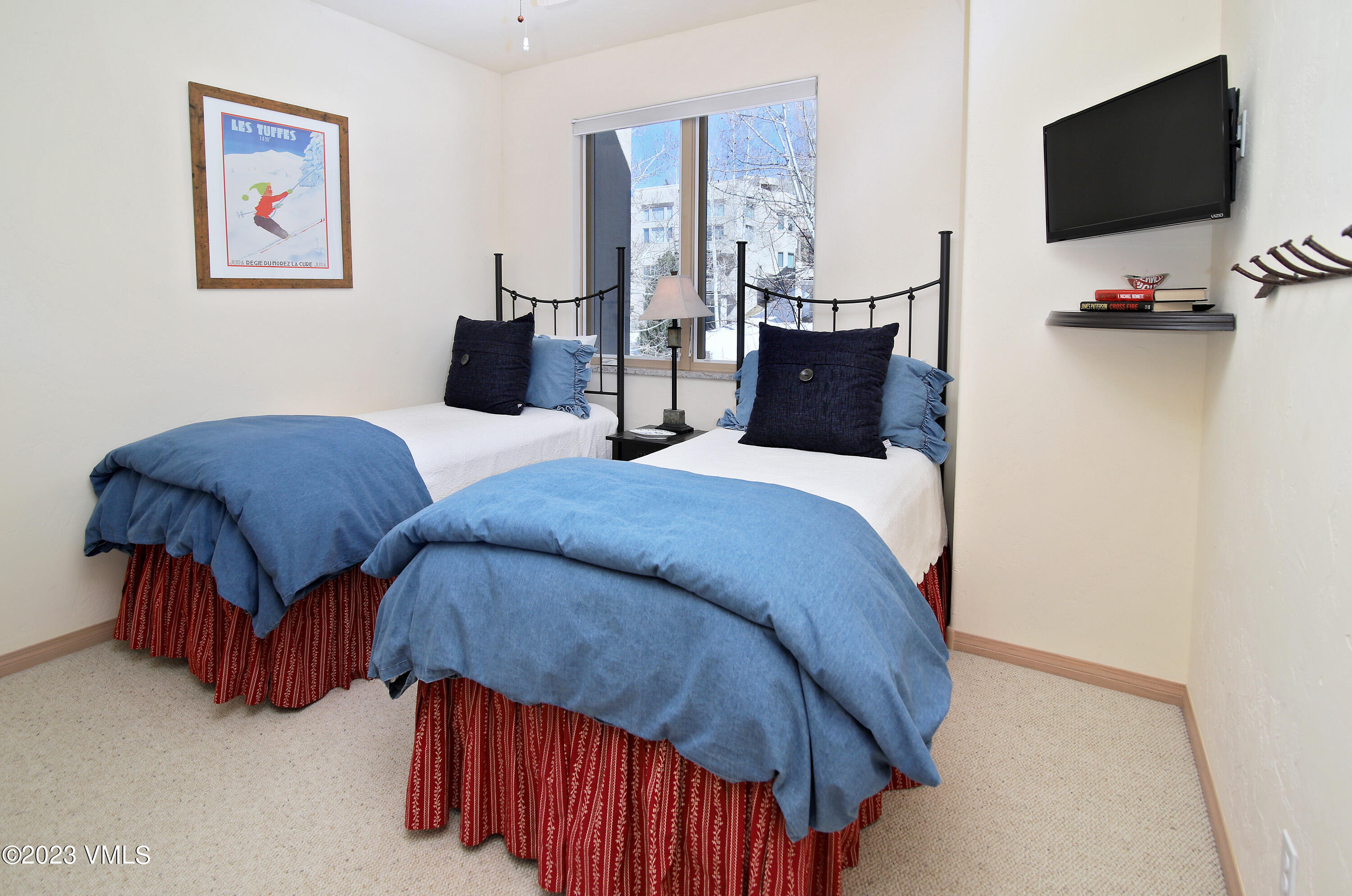 751 Singletree Road, Unit 6 Edwards, CO 81632 - Photo 15 of 30 a bedroom with two beds and a flat screen tv