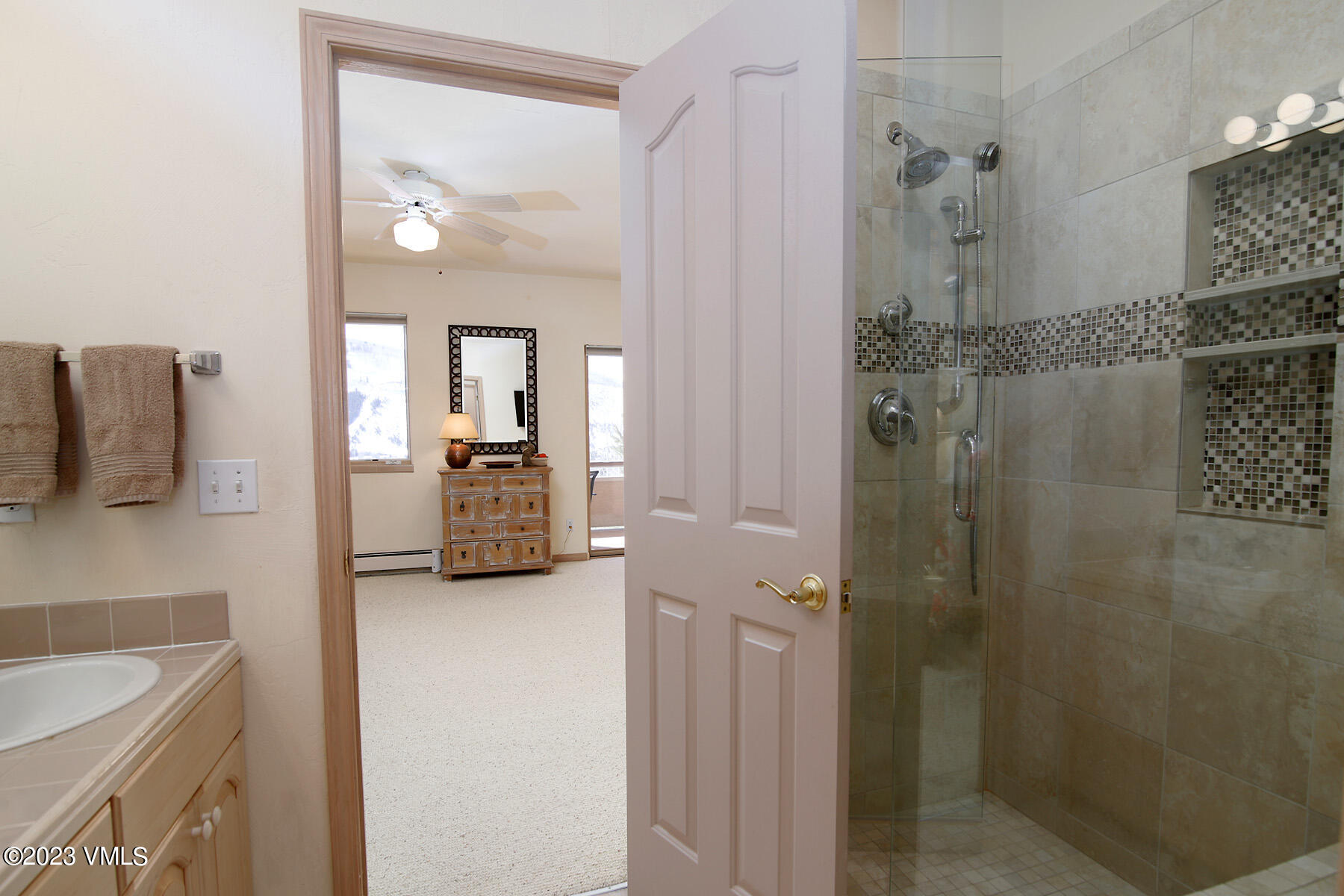 751 Singletree Road, Unit 6 Edwards, CO 81632 - Photo 19 of 30 a en suite bathroom with a granite countertop sink and a mirror
