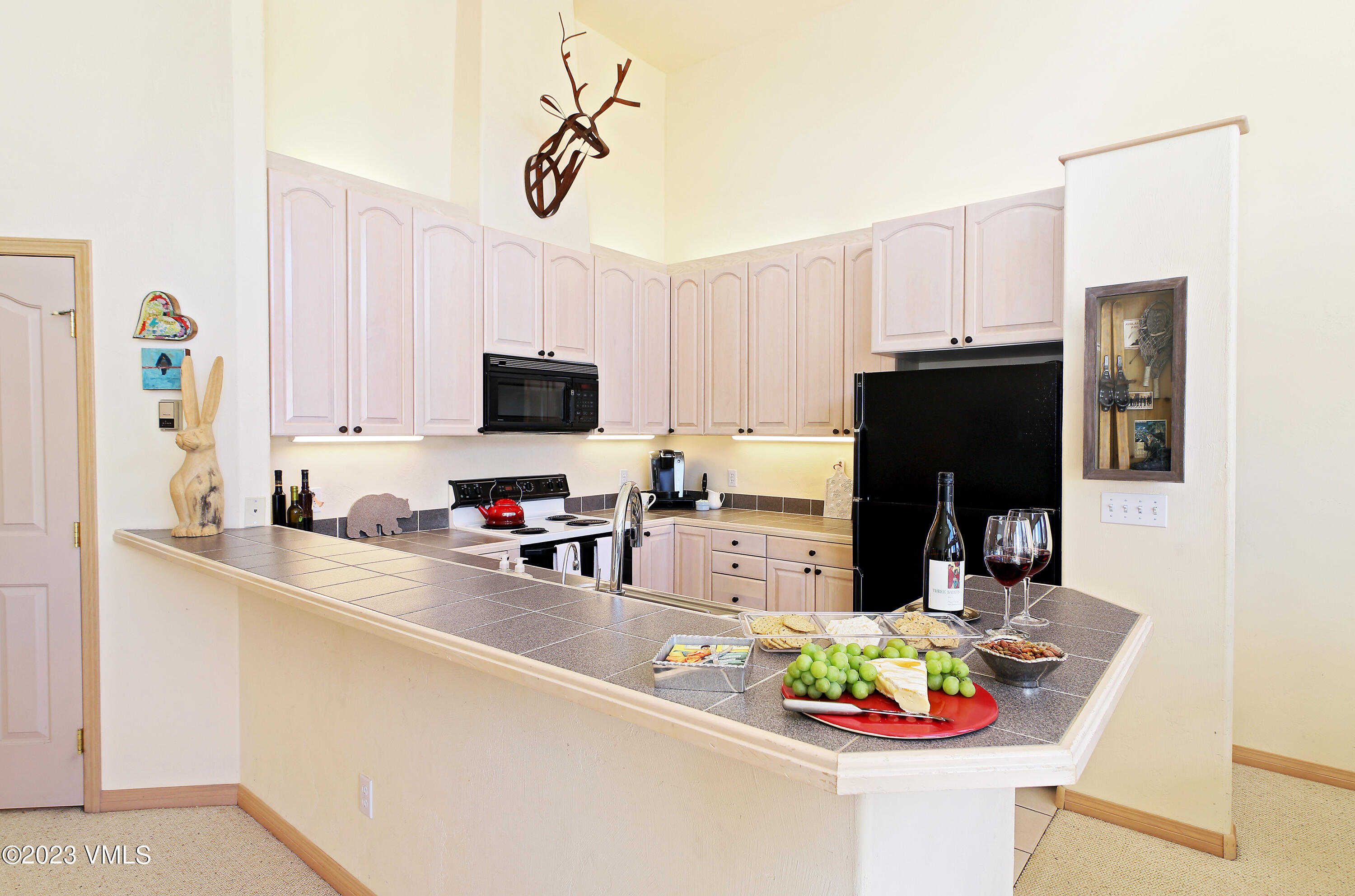 751 Singletree Road, Unit 6 Edwards, CO 81632 - Photo 28 of 30 a kitchen with stainless steel appliances granite countertop a sink dishwasher a refrigerator and a stove
