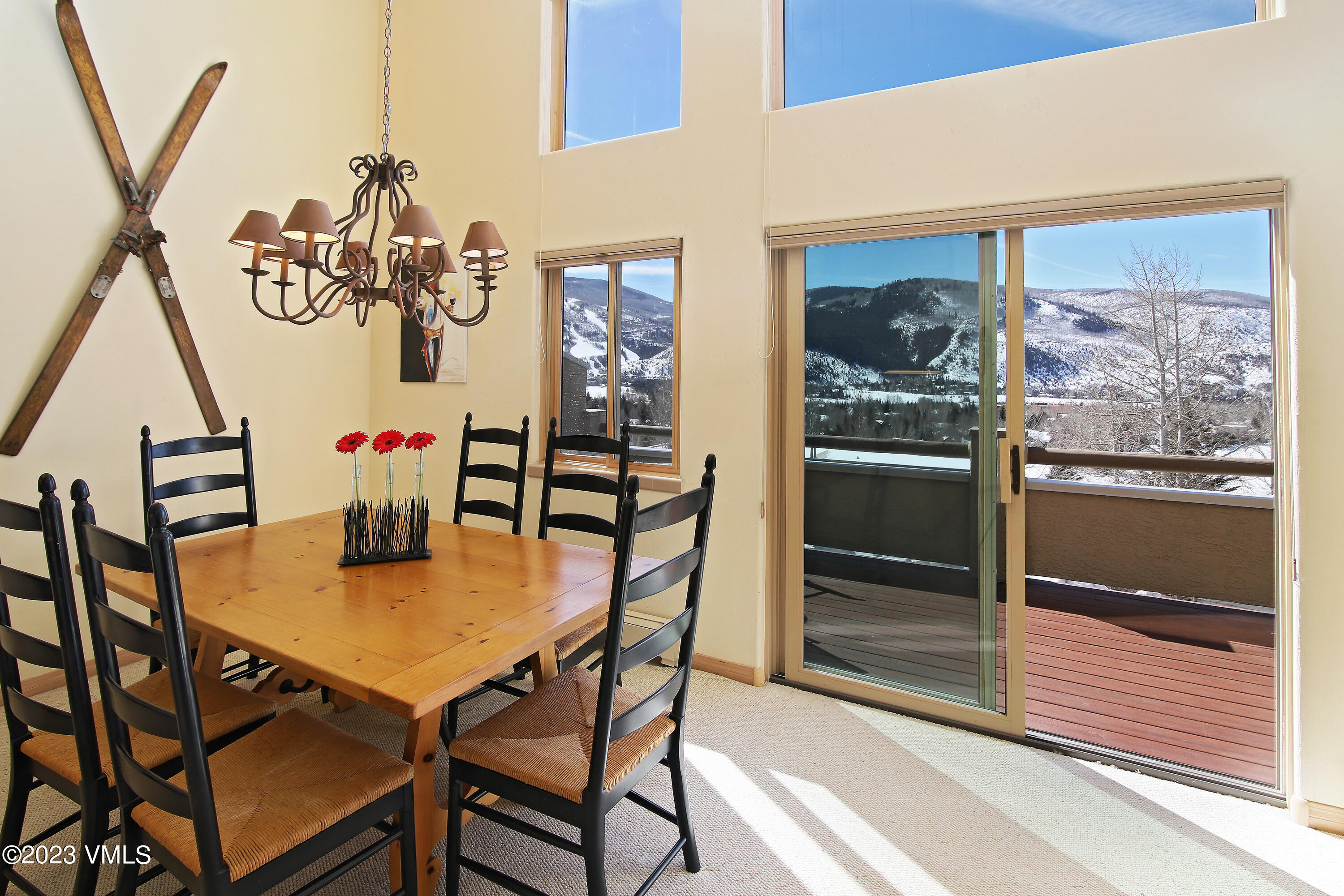 751 Singletree Road, Unit 6 Edwards, CO 81632 - Photo 4 of 30 a view of a dining room with furniture and wooden floor