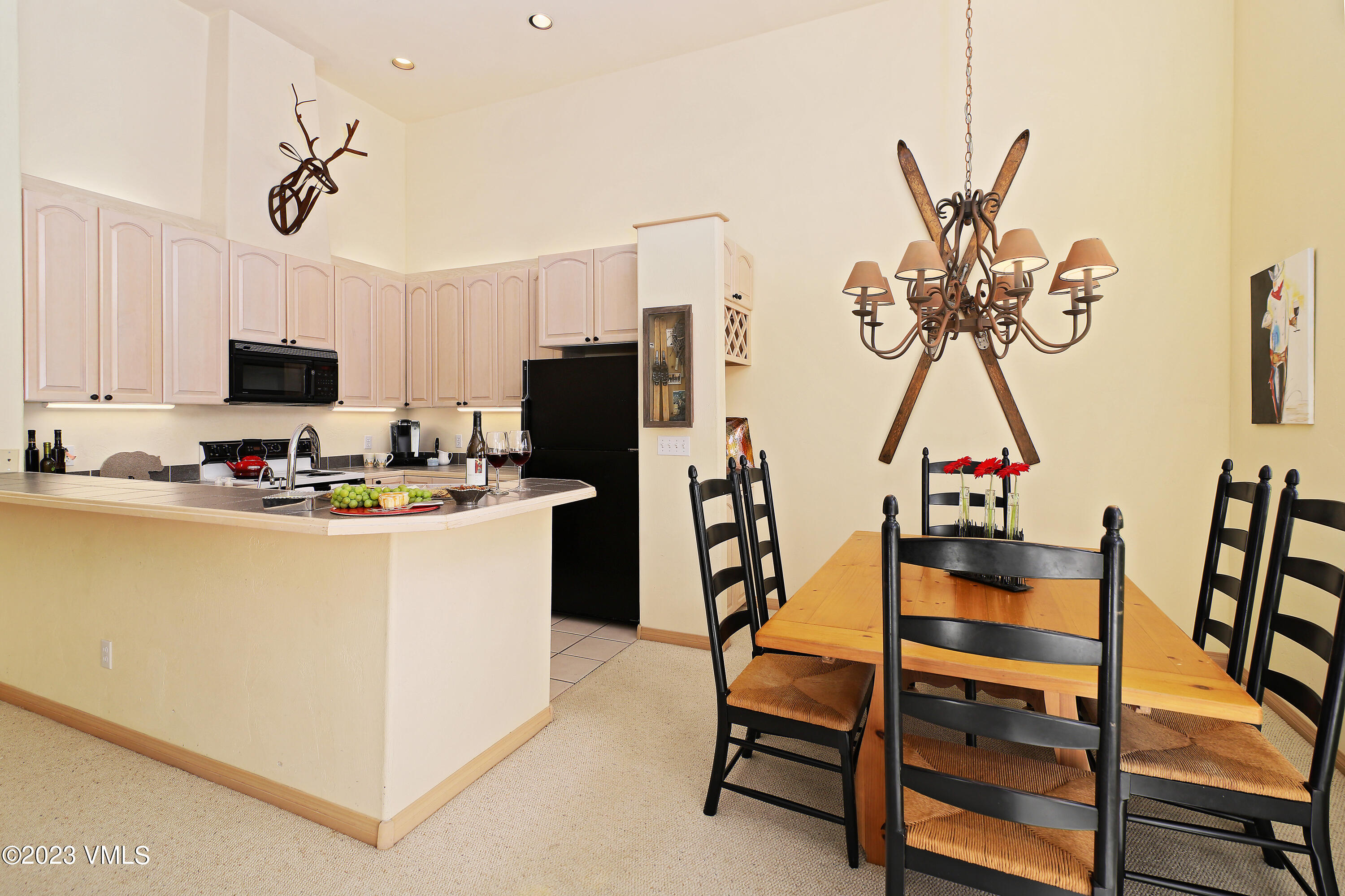 751 Singletree Road, Unit 6 Edwards, CO 81632 - Photo 7 of 30 a room with furniture a flat screen tv and a table