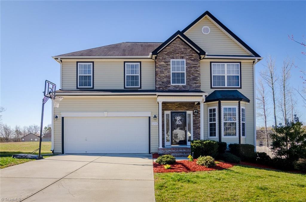 Beautiful stone and vinyl exterior and landscaping!