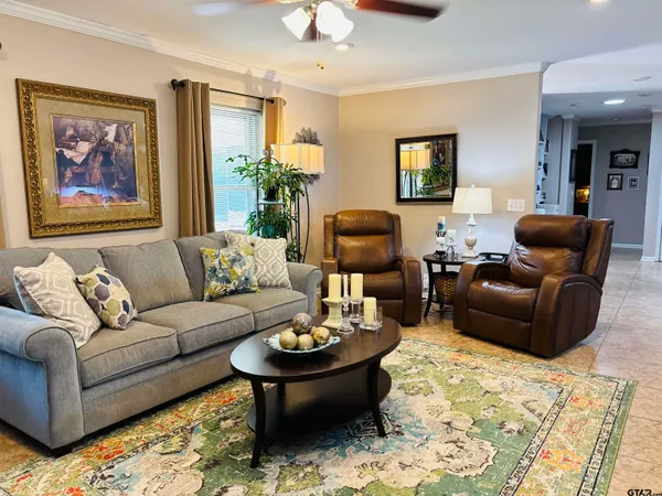 a kitchen with a sink a counter top space cabinets and stainless steel appliances