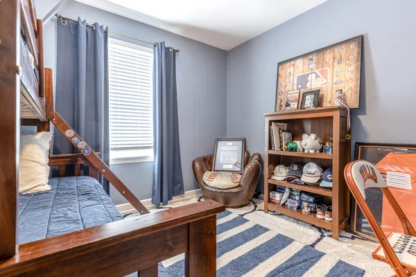 a living room with furniture a rug and a window