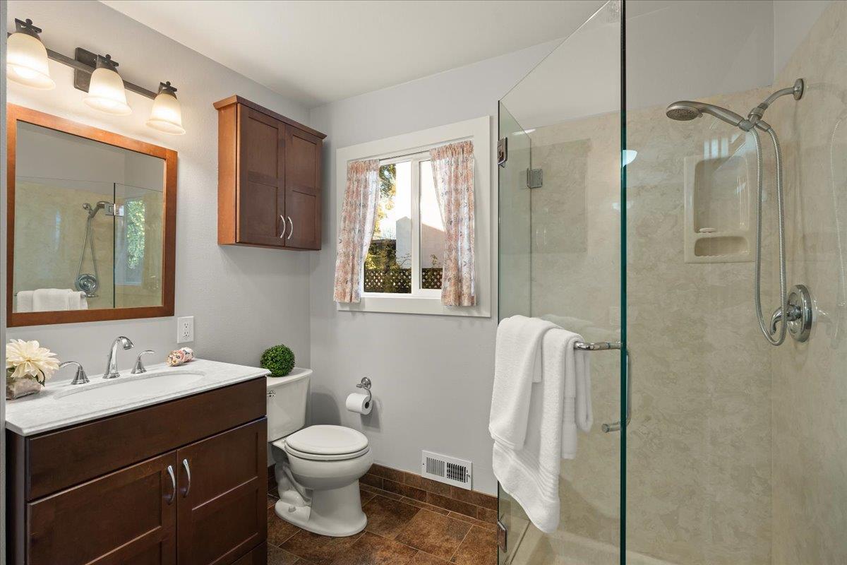 159 Anne Way Los Gatos, CA 95032 - Photo 18 of 50 a bathroom with a toilet sink and mirror