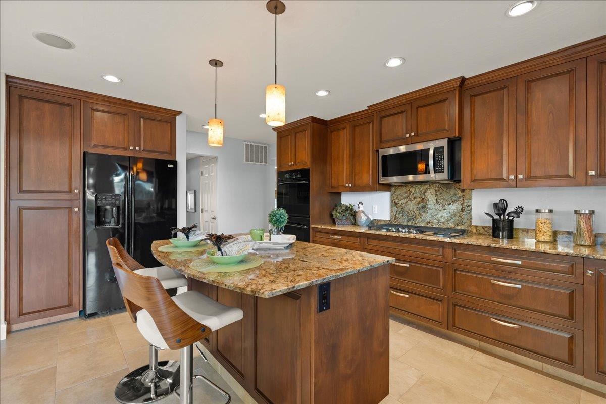 159 Anne Way Los Gatos, CA 95032 - Photo 21 of 50 a kitchen with stainless steel appliances granite countertop a refrigerator a stove a sink and a microwave