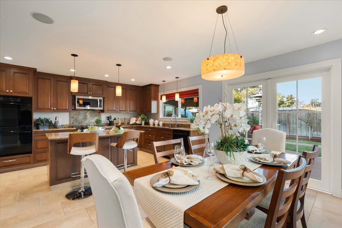 159 Anne Way Los Gatos, CA 95032 - Photo 23 of 50 a view of a dining room and livingroom with furniture wooden floor and a chandelier