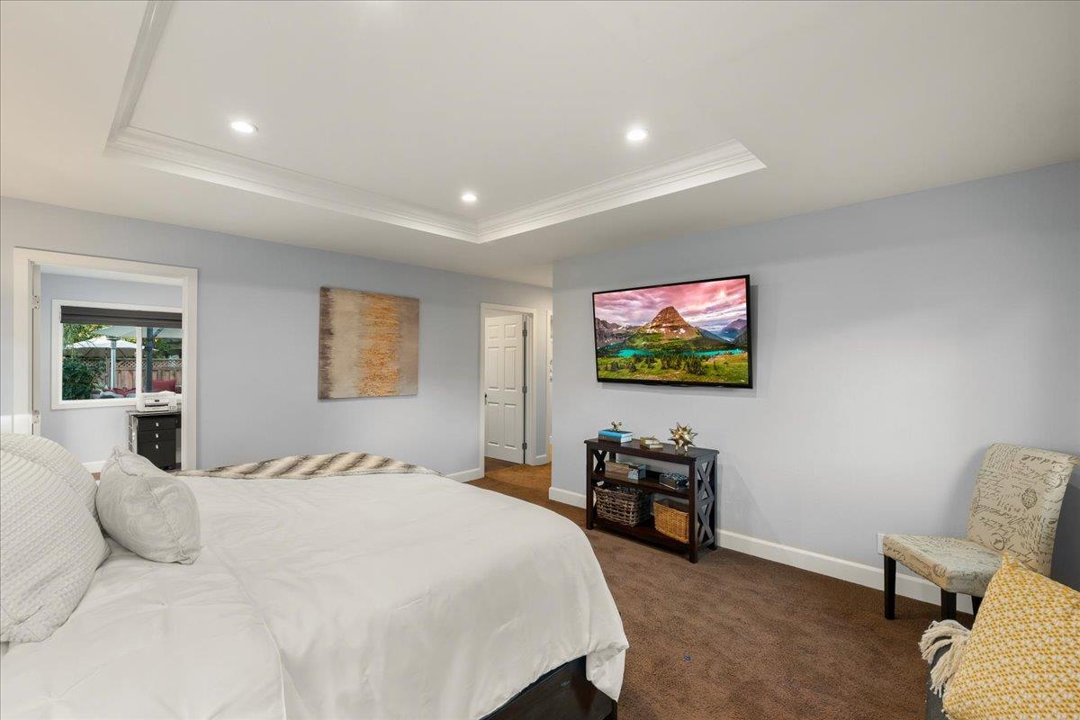 159 Anne Way Los Gatos, CA 95032 - Photo 30 of 50 a bedroom with a bed and a flat screen tv