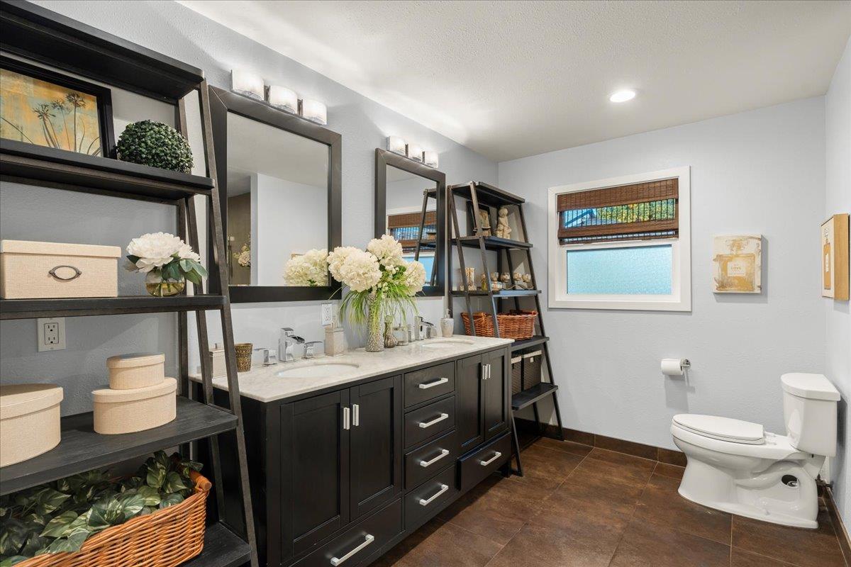159 Anne Way Los Gatos, CA 95032 - Photo 32 of 50 a bathroom with a toilet sink and mirror
