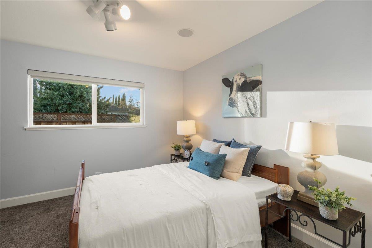 159 Anne Way Los Gatos, CA 95032 - Photo 35 of 50 a bedroom with bed and window