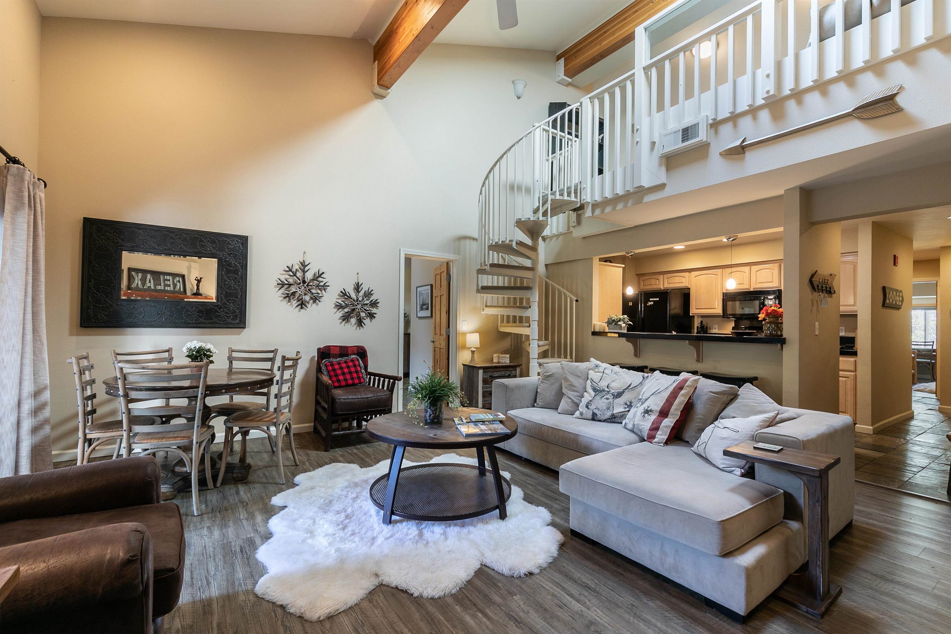 227 Olympic Vly Road, Unit 52 Olympic Valley, CA 96146 - Photo 1 of 21 a living room with furniture and a flat screen tv