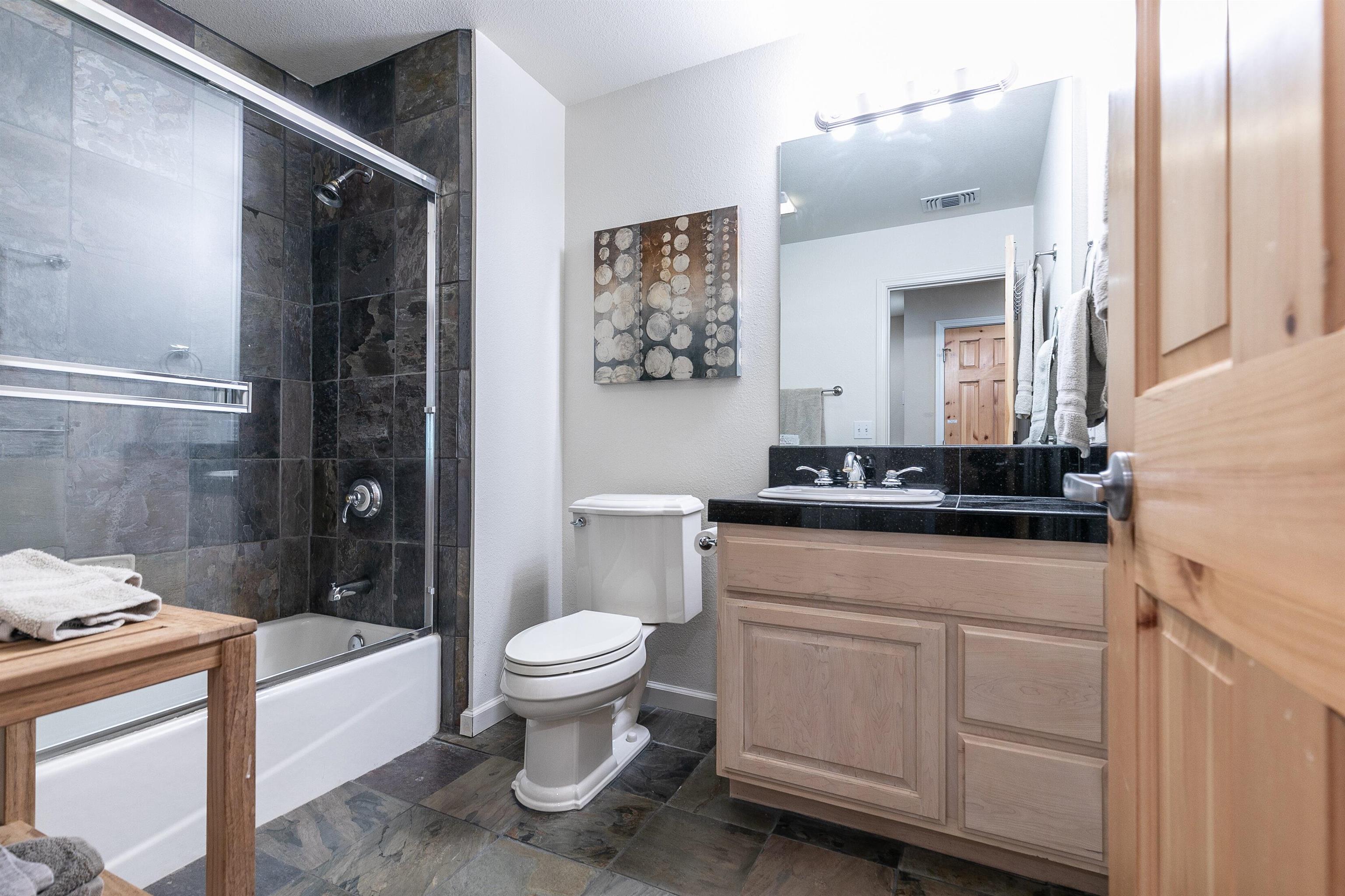 227 Olympic Vly Road, Unit 52 Olympic Valley, CA 96146 - Photo 16 of 21 a bathroom with a sink toilet and shower