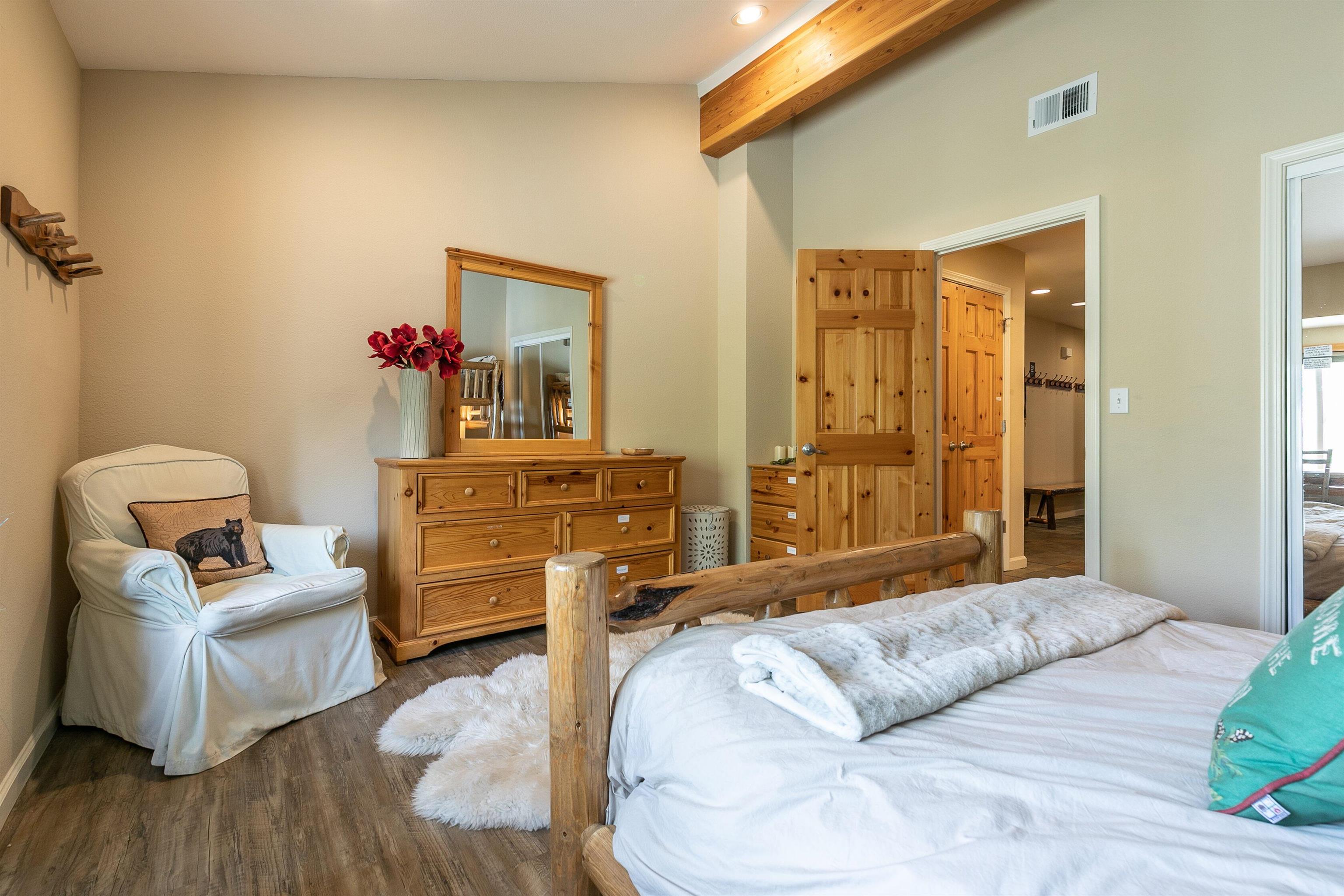 227 Olympic Vly Road, Unit 52 Olympic Valley, CA 96146 - Photo 17 of 21 a bedroom with a bed and wooden floor