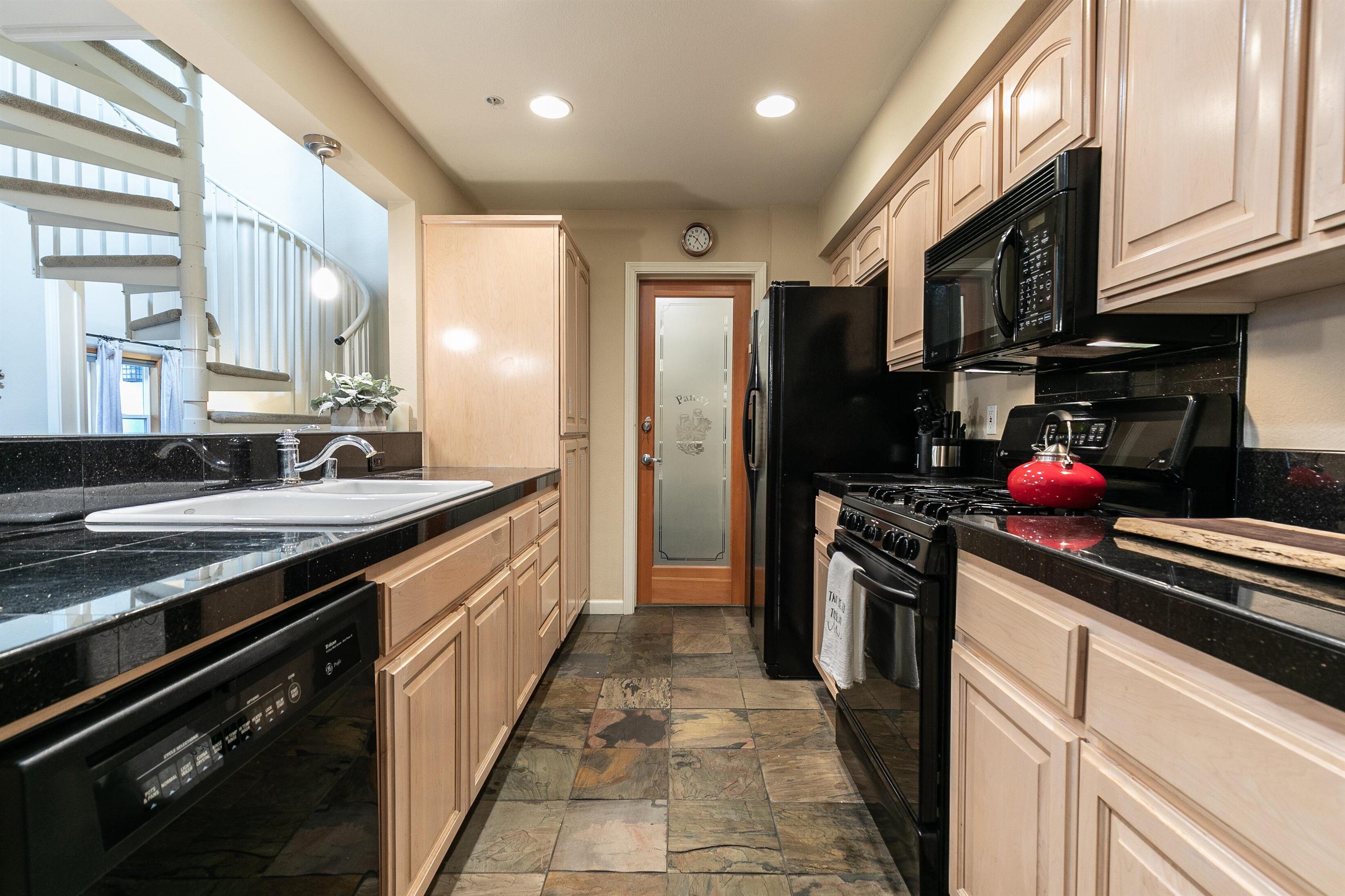 227 Olympic Vly Road, Unit 52 Olympic Valley, CA 96146 - Photo 20 of 21 a kitchen with stainless steel appliances granite countertop a sink stove and refrigerator