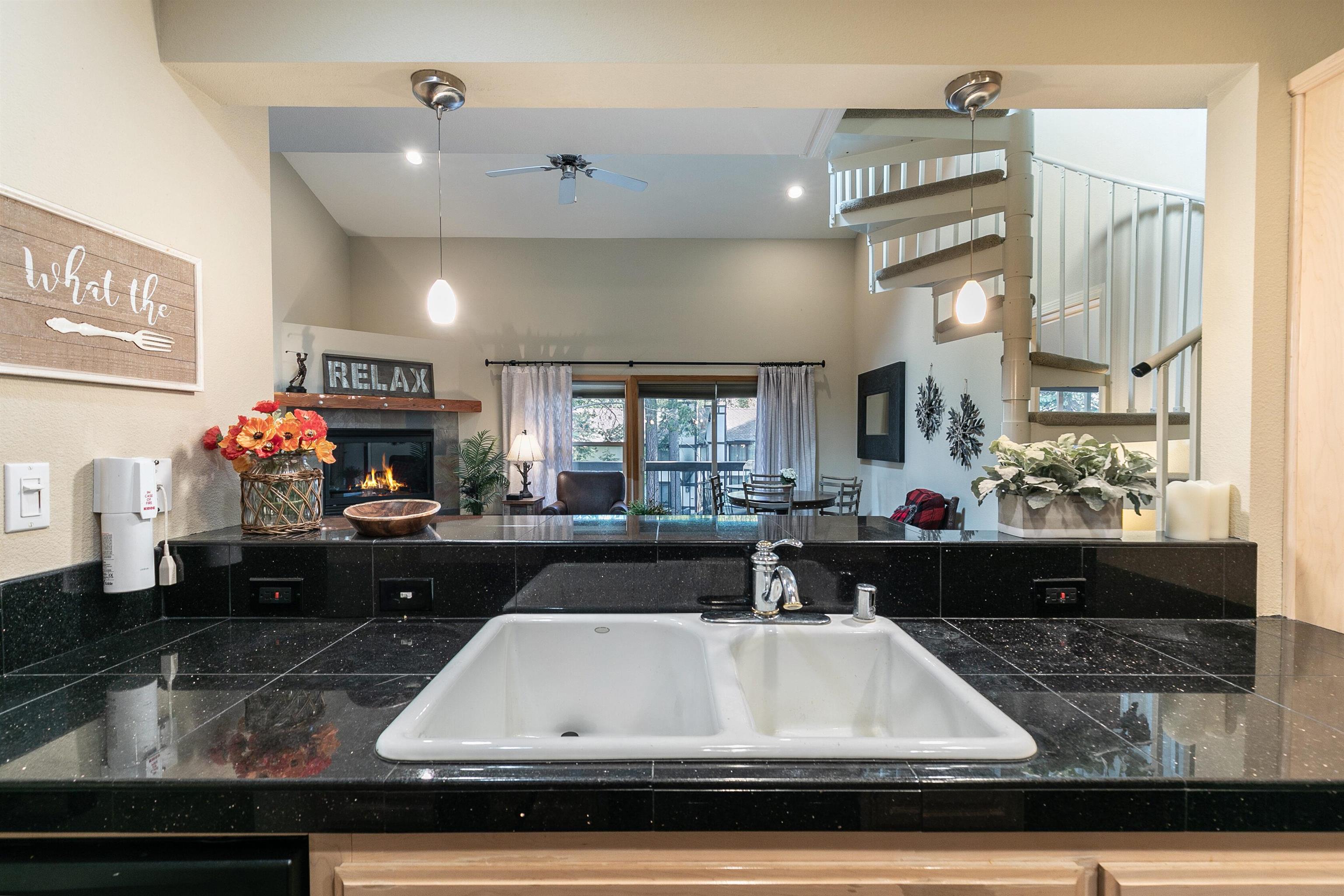 227 Olympic Vly Road, Unit 52 Olympic Valley, CA 96146 - Photo 21 of 21 a kitchen with a table and a stove