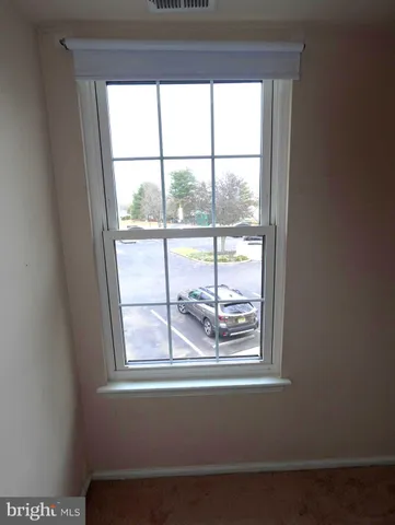 a view of a room that has a window in it
