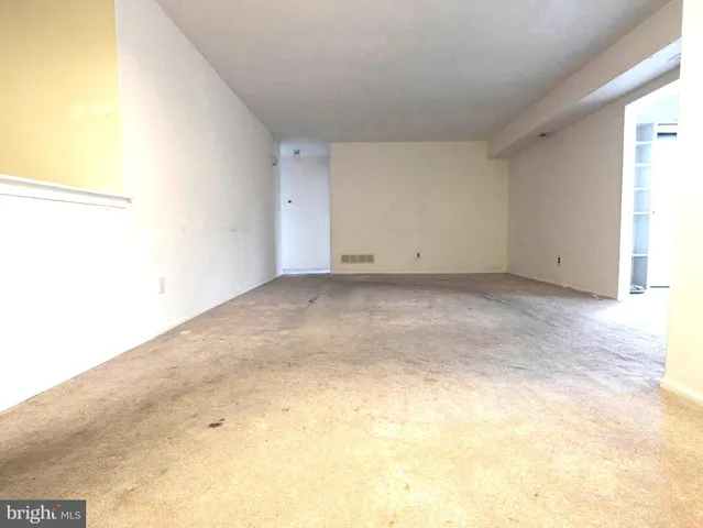 a view of a room with large windows