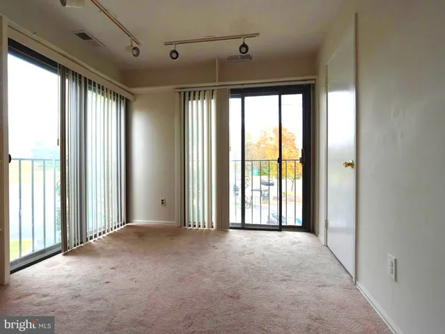 a view of a room with large windows