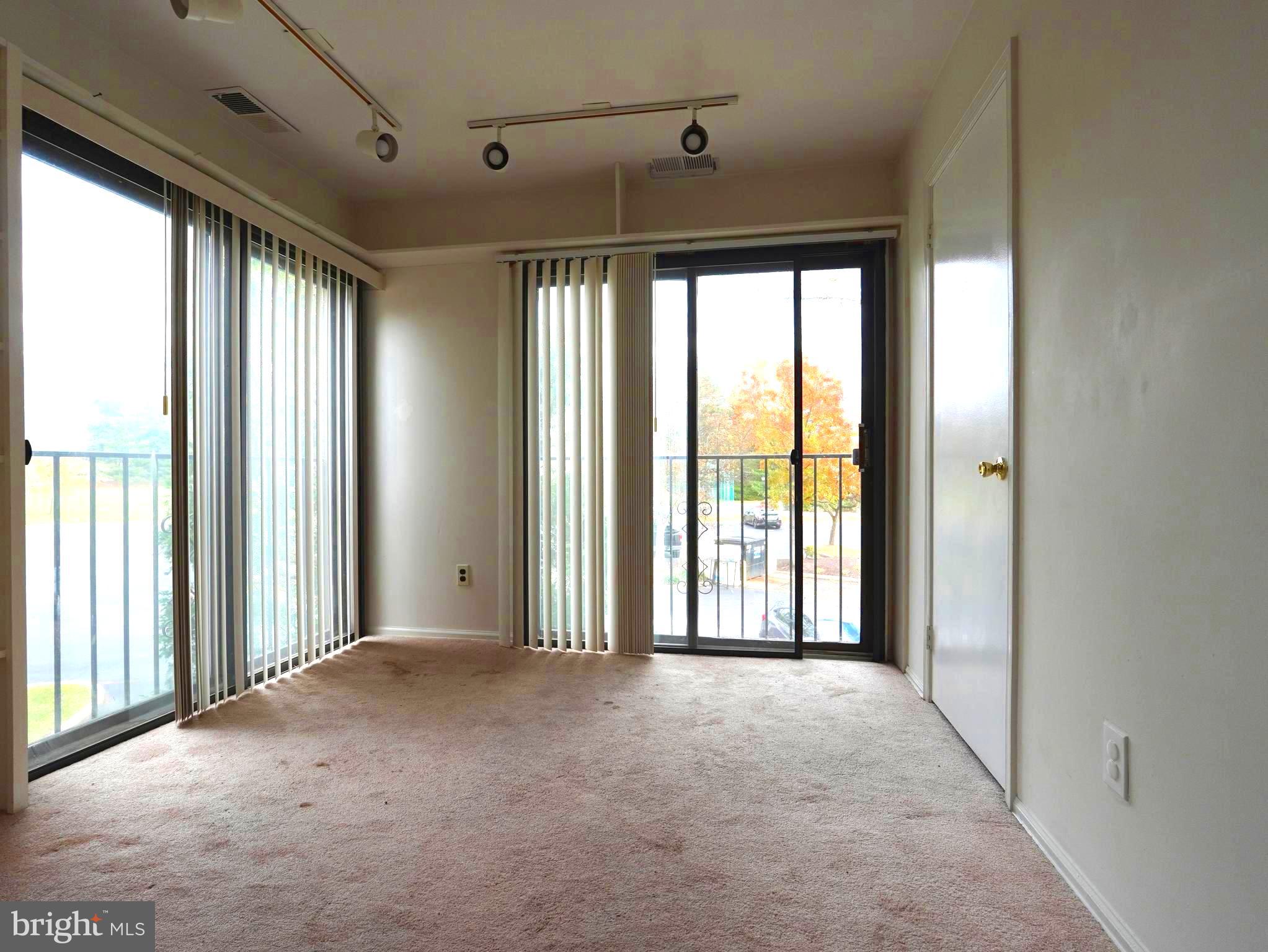 130 B Birchfield Court Mount Laurel, NJ 08054 - Photo 5 of 14 a view of a room with large windows