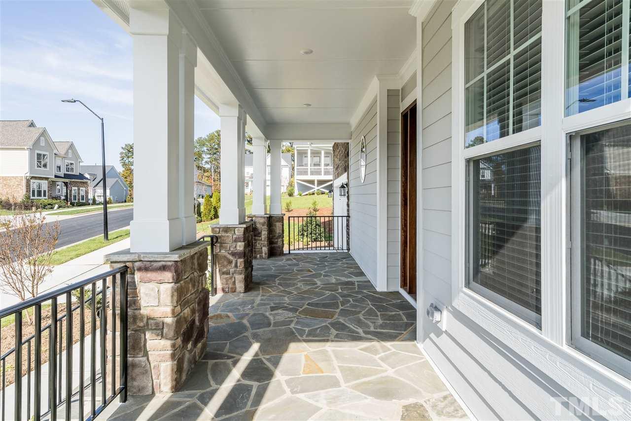 5928 Bellona Lane Raleigh, NC 27612 - Photo 2 of 25 a view of a porch with a table and chairs