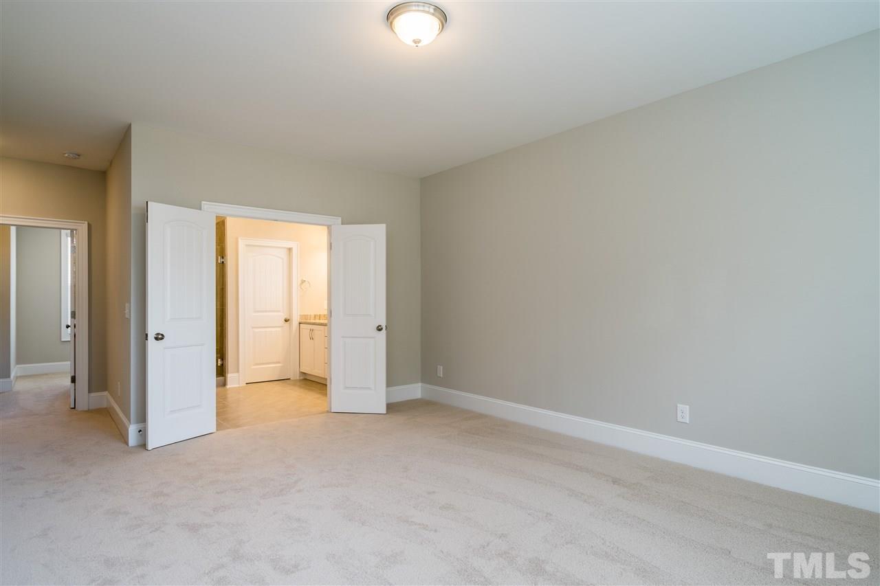 5928 Bellona Lane Raleigh, NC 27612 - Photo 17 of 25 an empty room with closet area and bathroom