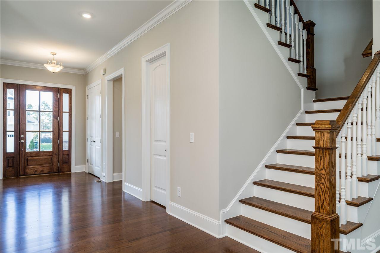 5928 Bellona Lane Raleigh, NC 27612 - Photo 3 of 25 a view of entryway with wooden floor and stairs
