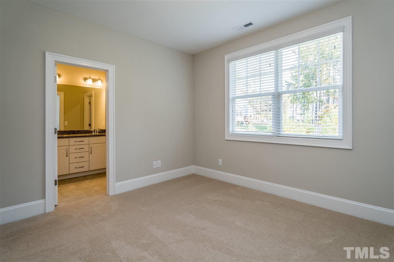 5928 Bellona Lane Raleigh, NC 27612 - Photo 21 of 25 an empty room with windows and closet
