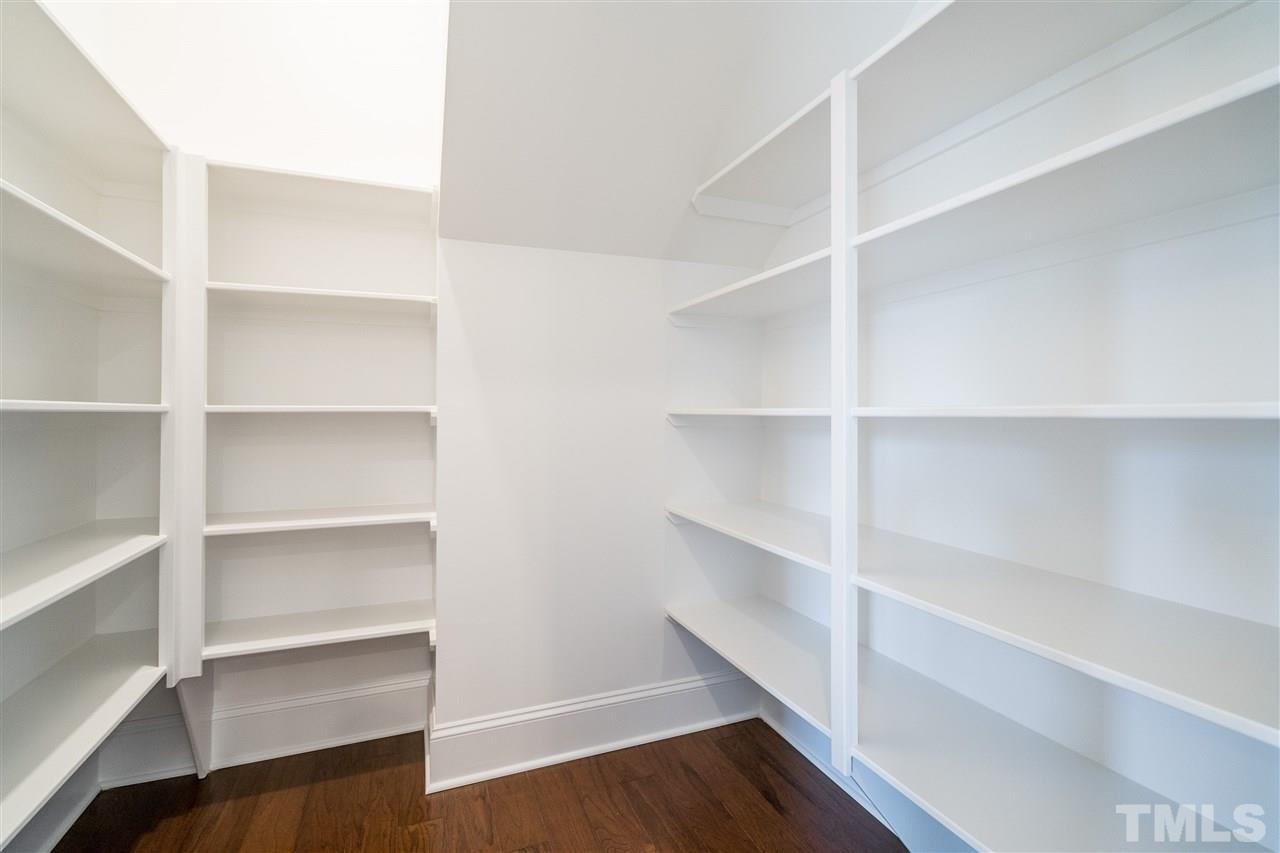 5928 Bellona Lane Raleigh, NC 27612 - Photo 10 of 25 a view of walk in closet with empty racks
